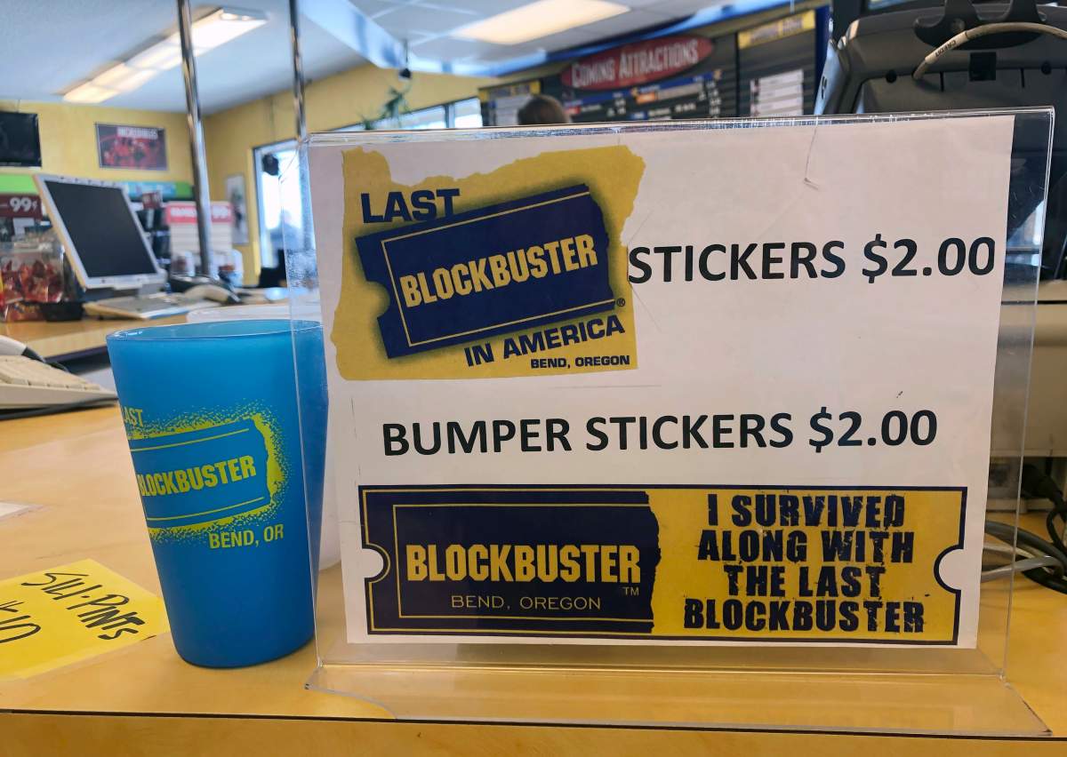 A sign advertising locally-made souvenirs from the last Blockbuster store on the planet sits in the store in Bend, Ore., in this Tuesday, March 12, 2019 photo.