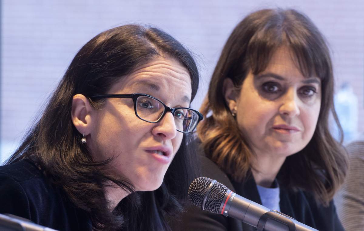 Quebec Justice Minister Sonia Lebel responds to a question as Véronique Hivon of the PQ listens after announcing the formation of a committee of experts to accompany victims of sexual assault and of domestic violence in Montreal on Monday, March 18, 2019. 