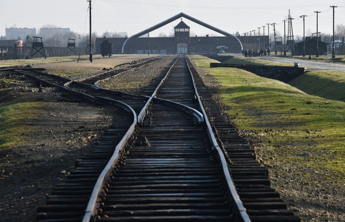 A view of train tracks and the Gate of Death (background) at the former Nazi-German concentration and extermination camp KL Auschwitz II-Birkenau in Oswiecim, Poland, on January 15, 2015.