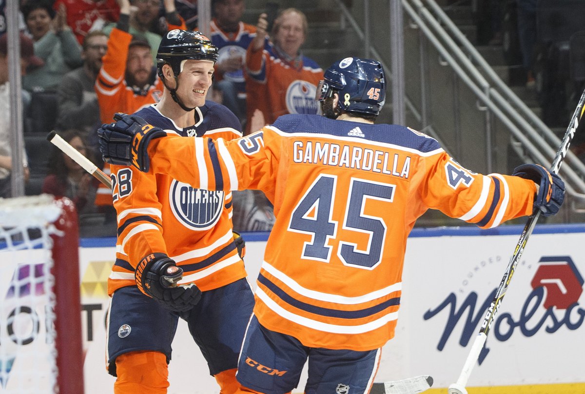 Edmonton Oilers' Kyle Brodziak (28) and Joseph Gambardella (45) celebrate a goal against the Columbus Blue Jackets during second period NHL action in Edmonton, Alta., on Thursday March 21, 2019. THE CANADIAN PRESS/Jason Franson.