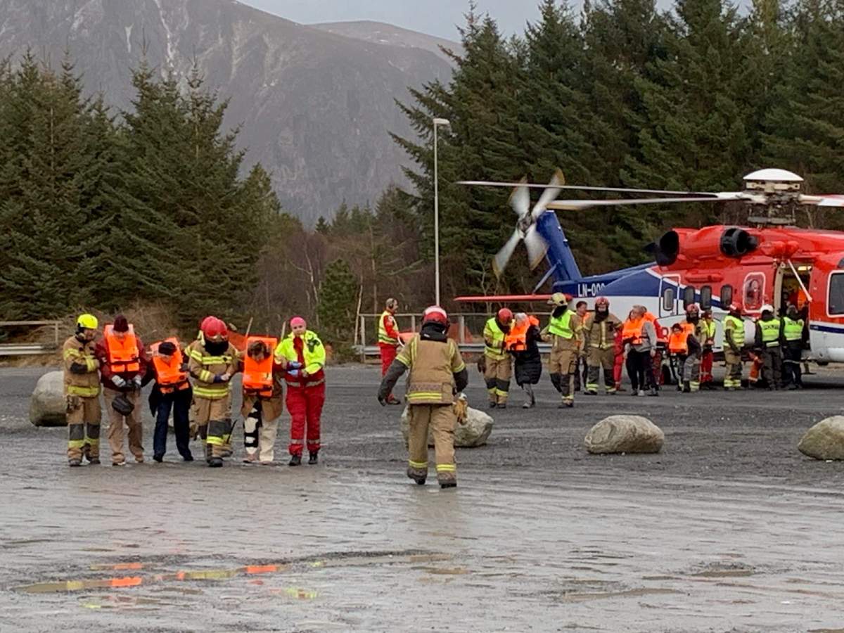 Passenger that has been rescued by helicopter from the cruise ship Viking Sky with members of the emergency services in Hustadvika, Norway, March 23 2019.