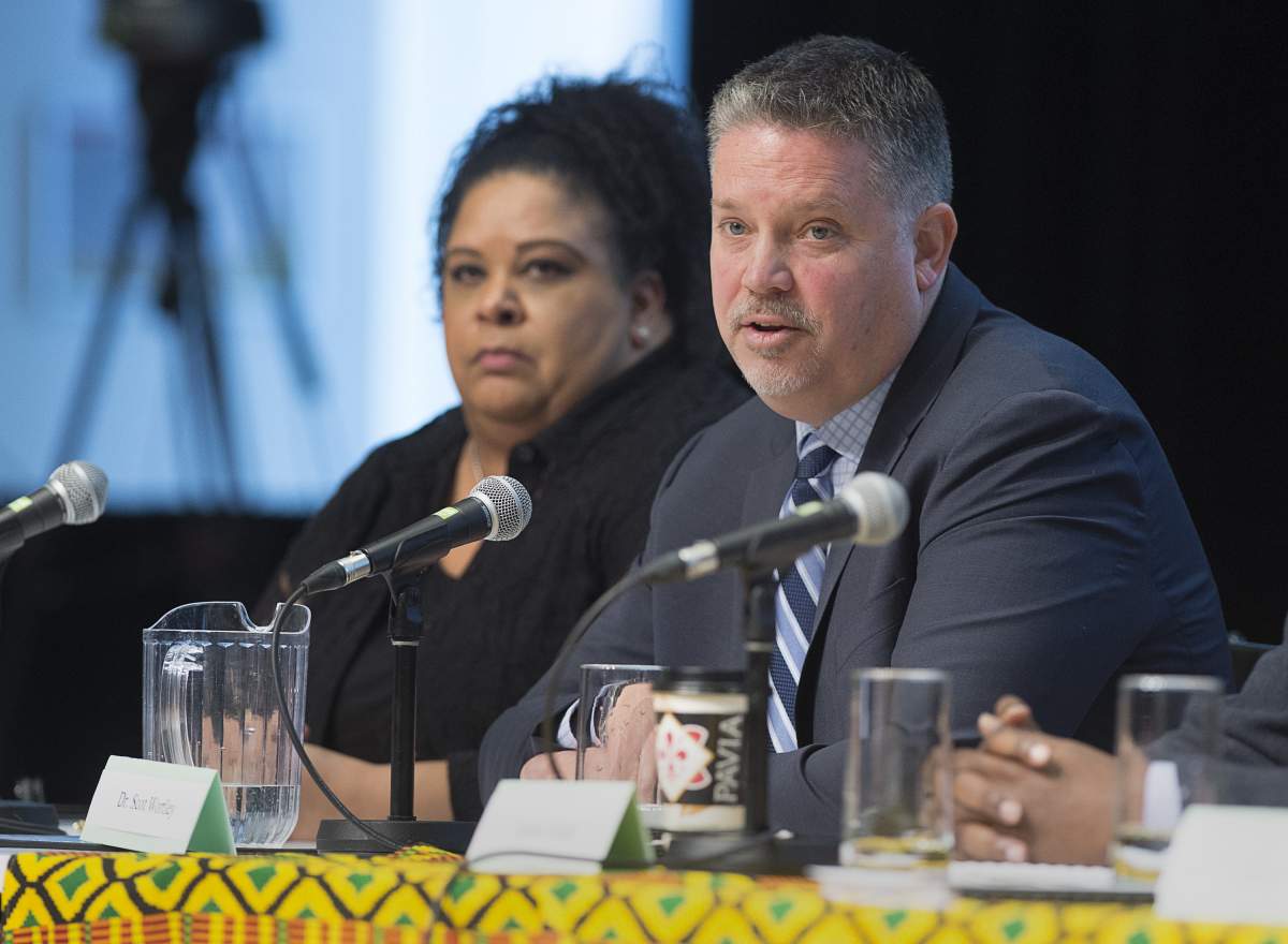 Criminologist Scot Wortley, right, fields question after delivering his findings on the issue of police street checks, as Kimberley Franklin, legal counsel for the Nova Scotia Human Rights Commission, looks on in Halifax on Wednesday, March 27, 2019.