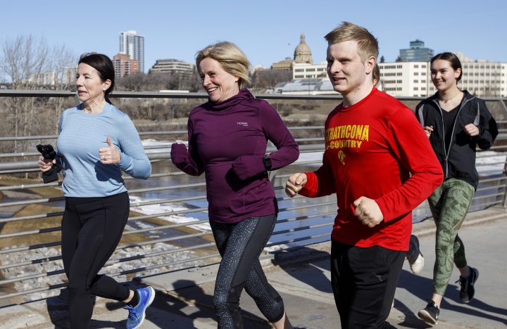 Alberta NDP Leader Rachel Notley runs with her son Ethan, right and friends in Edmonton on Saturday, March 30, 2019. Albertans vote in a provincial election on April 16.