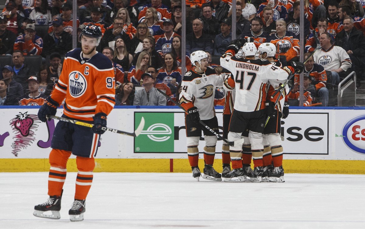 Anaheim Ducks celebrate a goal as Edmonton Oilers' Connor McDavid (97) skates to the bench during second period NHL action in Edmonton, Alta., on Saturday March 30, 2019. THE CANADIAN PRESS/Jason Franson.