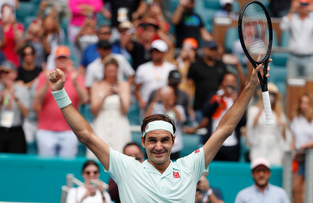 Roger Federer of Switzerland celebrates after defeating John Isner of the US following their Men's finals match at the Miami Open tennis tournament in Miami, Florida, USA, 31 March 2019.  