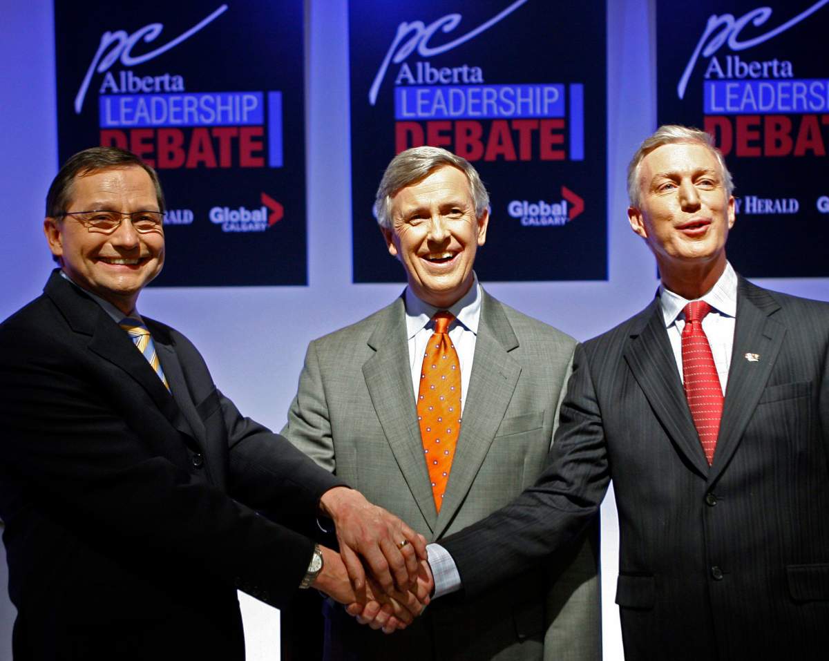 Ed Stelmach, left, Jim Dinning, centre, and Ted Morton, pose before the start of the Alberta Progressive Conservative televised leadership debate in Calgary, Thursday, Nov. 30, 2006.