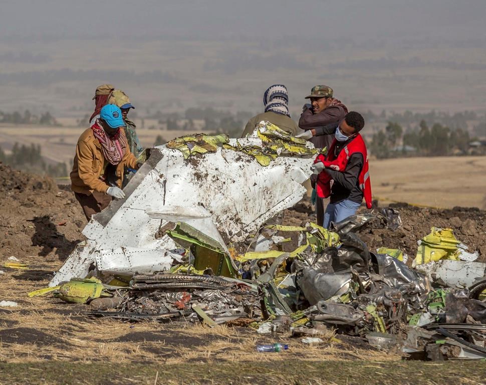Rescuers work at the scene of an Ethiopian Airlines flight crash near Bishoftu, south of Addis Ababa, Ethiopia, Monday, March 11, 2019. A spokesman says Ethiopian Airlines has grounded all its Boeing 737 MAX 8 aircraft as a safety precaution following the crash of one of its planes in which 157 people were killed. (AP Photo/Mulugeta Ayene)