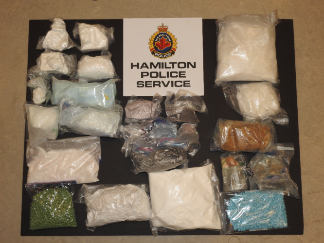 A drug trafficking investigation has led Hamilton Police to seize over a million dollars worth of cocaine, methamphetamine, heroin, fentanyl and purple heroin, as well as over 3,000 pills.