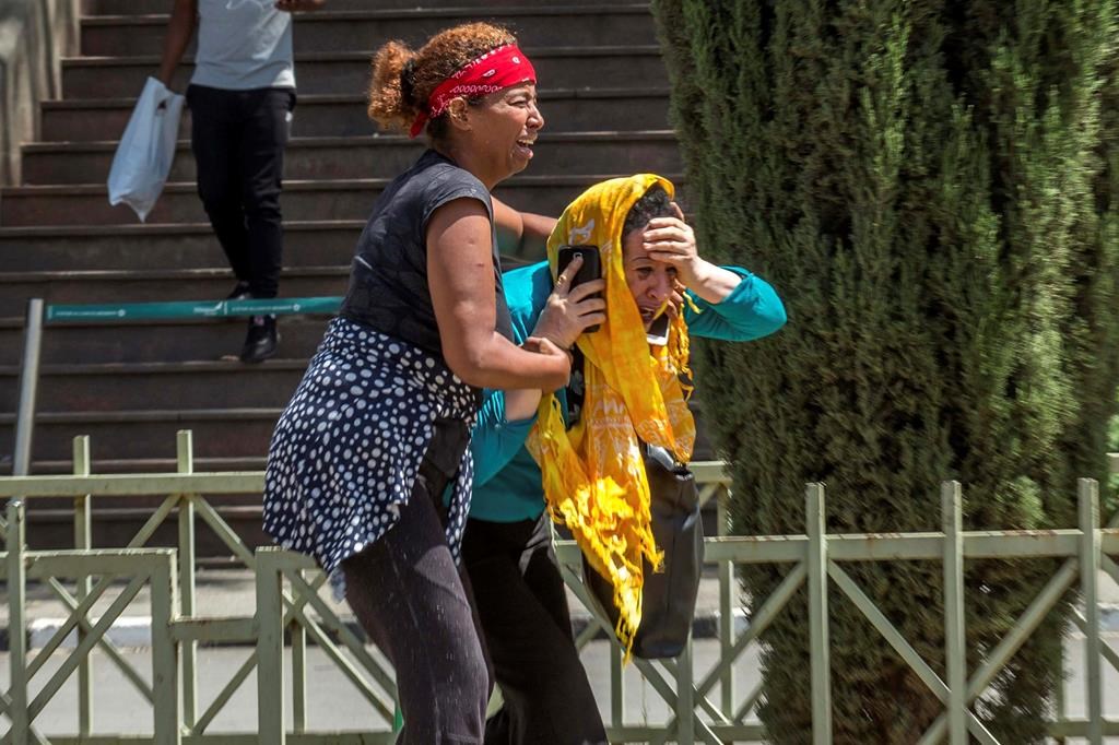 Family members of the victims involved in a plane crash react at Addis Ababa international airport Sunday, March 10, 2019.