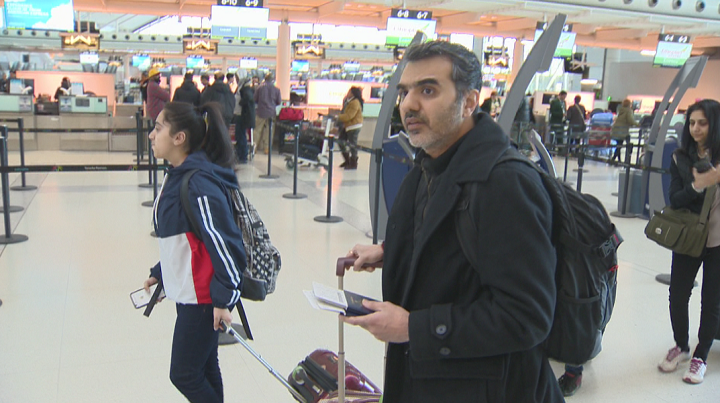 Manant Vaidya is seen at Pearson Airport on Saturday morning. He is travelling to Ethiopia with his wife Hiral and their two children in hopes of finding the remains of six family members who died in the Ethiopian Airlines crash last Sunday.