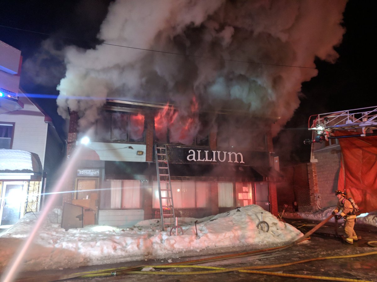A heavy fire ripped through Holland Avenue's Allium Restaurant early on Friday morning. Ottawa firefighters battled the blaze defensively from outside the two-storey building.
