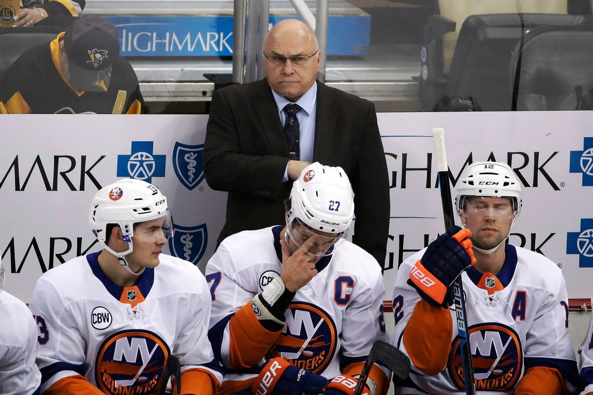 New York Islanders head coach Barry Trotz stands behind his bench during the first period of an NHL hockey game against the Pittsburgh Penguins, in Pittsburgh. Trotz's Islanders are in playoff position and Trotz is also a candidate for the Jack Adams Award.