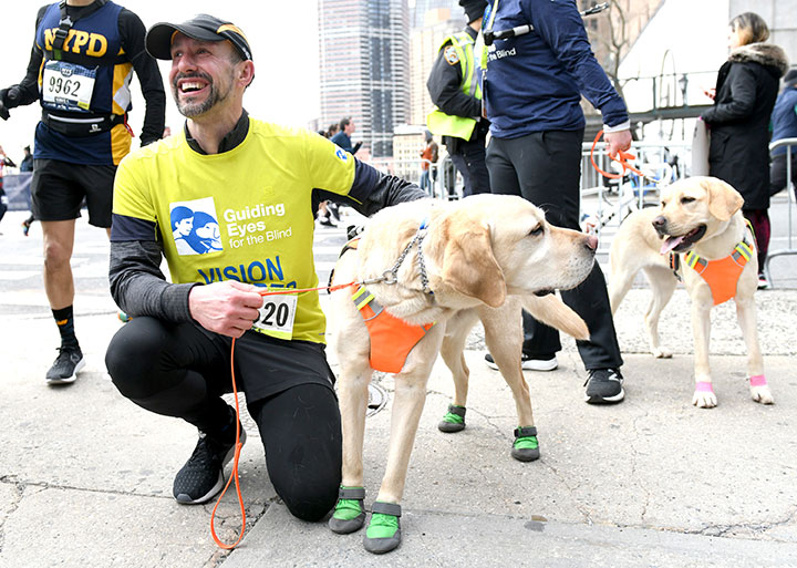 Blind runner and his guide dogs make history by finishing New York City