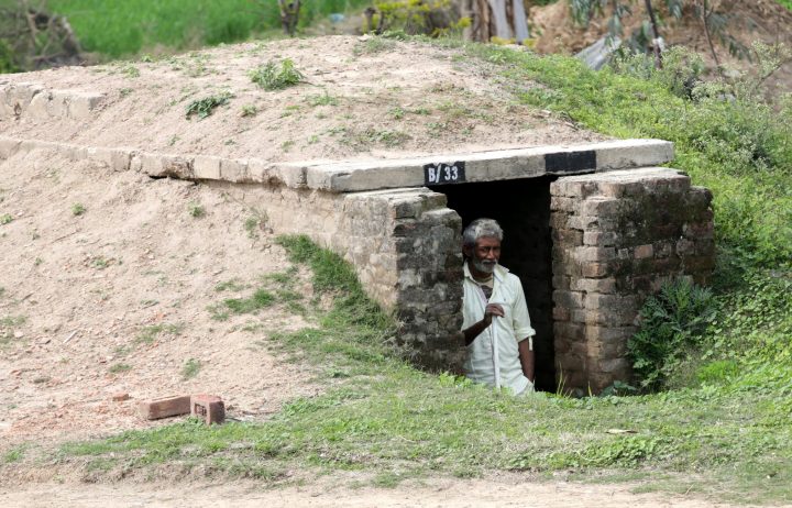 An Indian border villager looks out from a community bunker in wake of border tension between India and Pakistan, at Abdullian village of Ranbir Singh Pura sector near the India-Pakistan international border, about 35 km from Jammu, the winter capital of Kashmir, India, on Feb. 28, 2019.