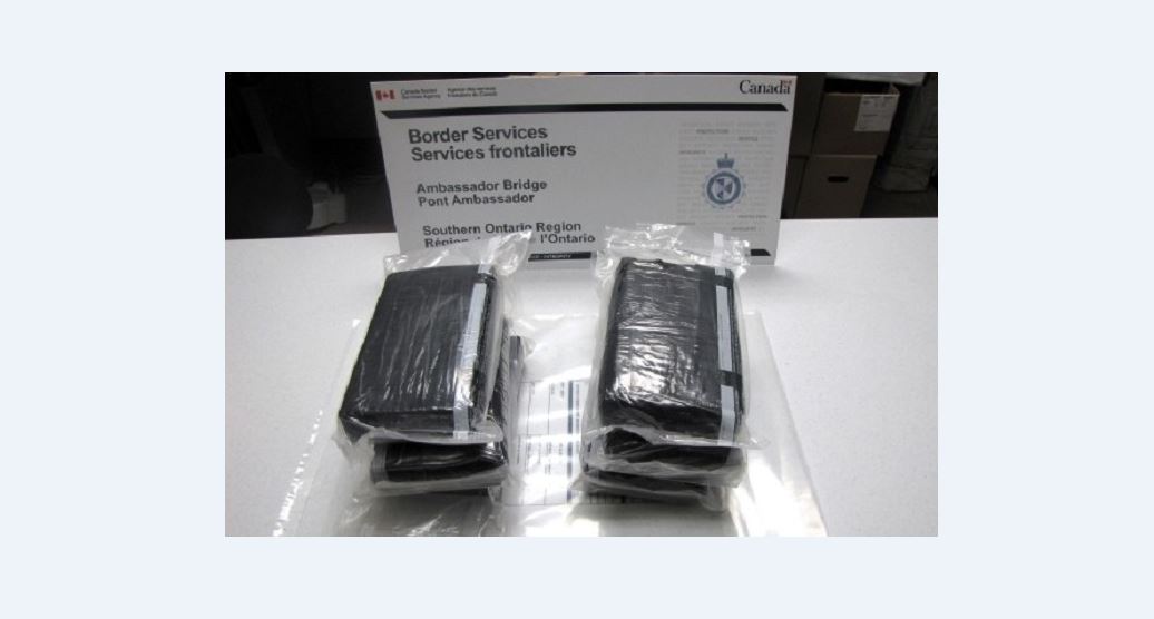 Officials say 8.2 kilograms of suspected cocaine was first found hidden in the cab of a tractor-trailer returning from the United States on Feb. 19.