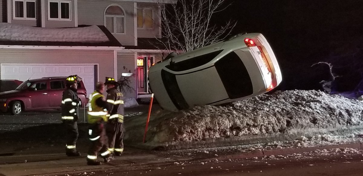 A car is overturned on a snowbank in Shediac Drive in Moncton on March 16, 2019. 