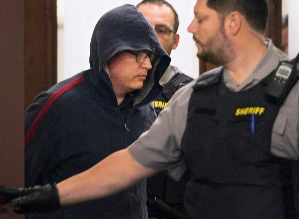 Jeffrey Delisle leaves court in Halifax on Oct. 10, 2012.