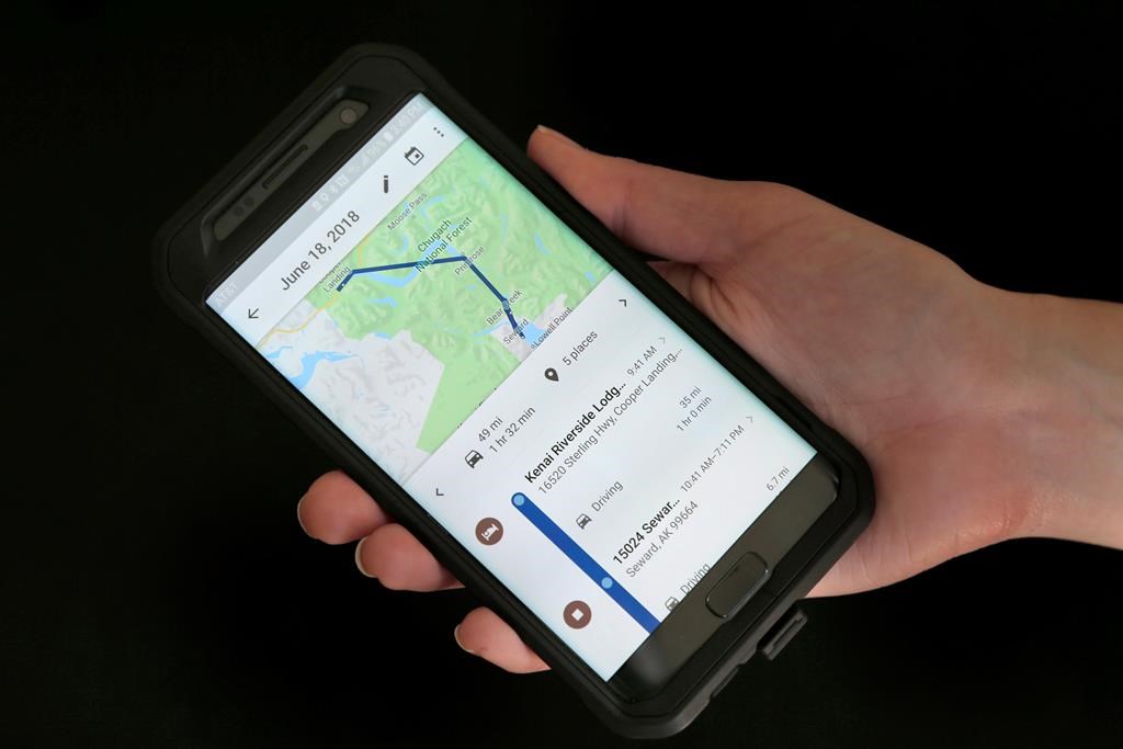 In this Aug. 8, 2018, file photo, a mobile phone displays a user's travels using Google Maps in New York. Drivers using Google Maps are now getting a last-minute warning as they approach some photo radar camera locations.