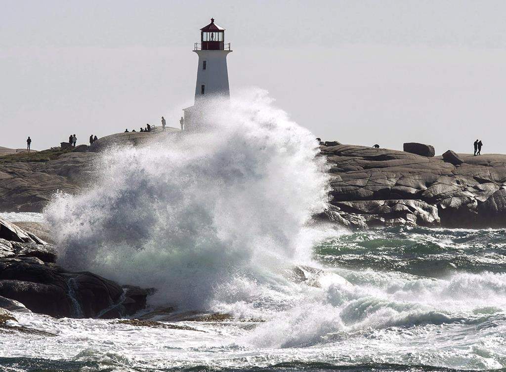 Waves hit the shore at Peggy's Cove, N.S. on Tuesday, Oct. 16, 2018 as high winds buffet the coast.