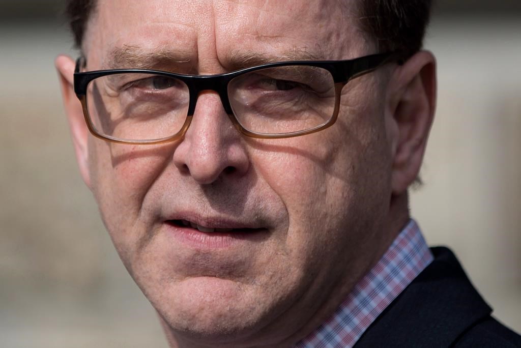 British Columbia Health Minister Adrian Dix pauses while speaking at Woodlands Memorial Garden in New Westminster, B.C., on Saturday March 31, 2018.