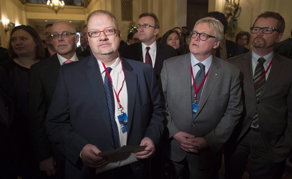 Minister Kelvin Goertzen, (centre left). The Manitoba government will be getting advice on education reform from a consultant who recently prompted Nova Scotia to eliminate elected school boards and make other sweeping changes. THE CANADIAN PRESS/Adrian Wyld