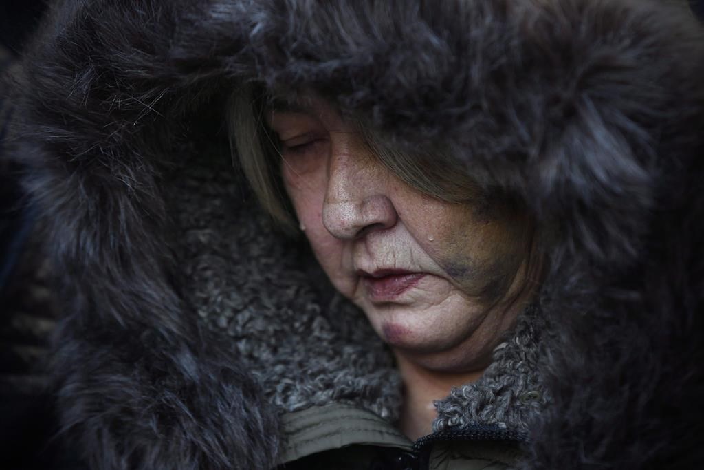 Thelma Favel, Tina Fontaine's great aunt and the woman who raised her, sheds tears during a march the day after the jury delivered a not-guilty verdict in the second-degree murder trial of Raymond Cormier, in Winnipeg, Friday, Feb. 23, 2018.