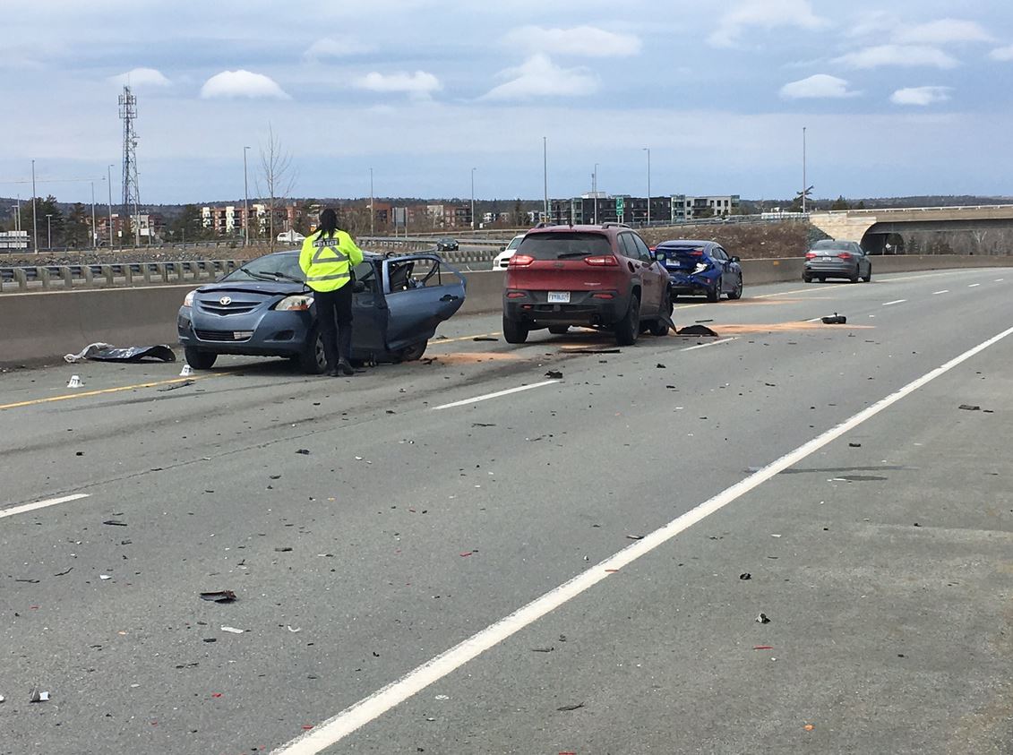 Halifax Regional Police attend the scene of a crash on Highway 102 on Friday, March 29, 2019. 