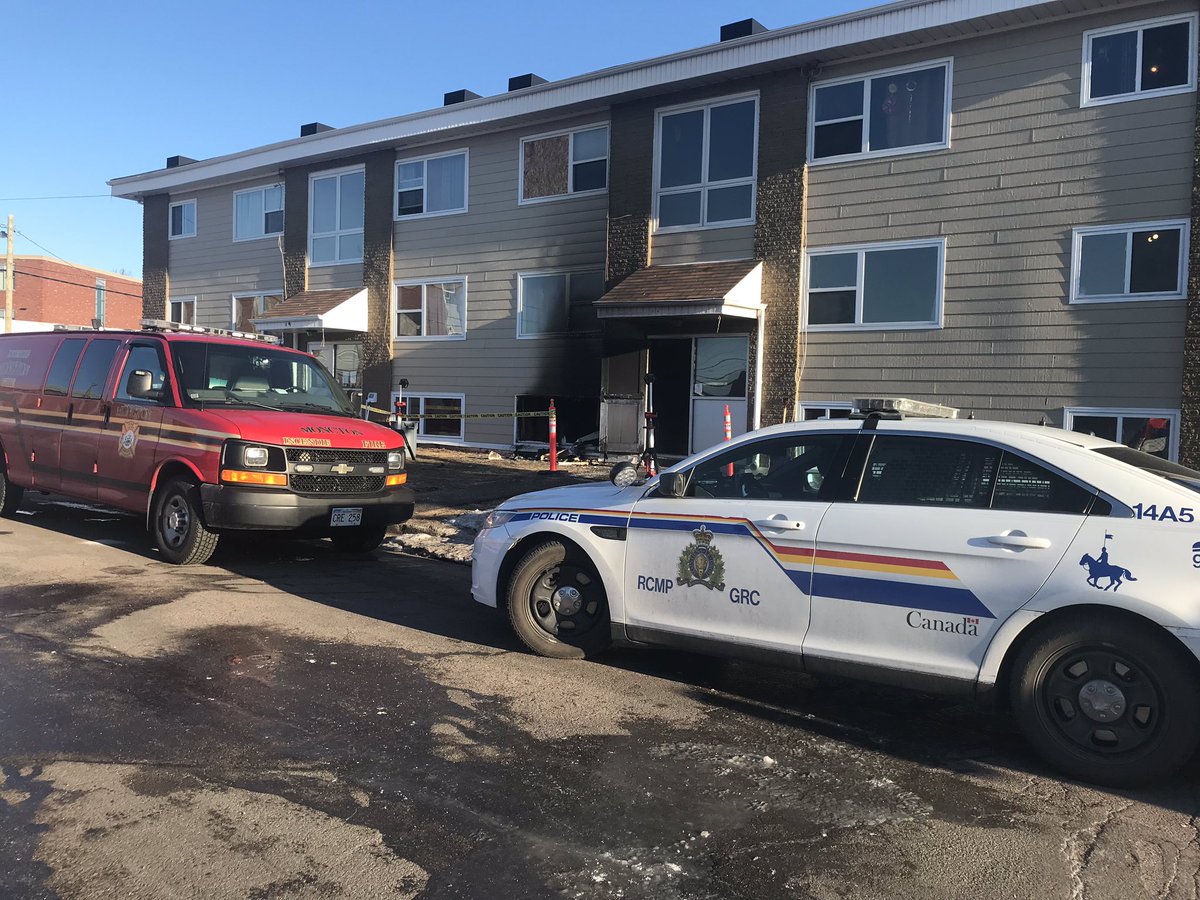 Fire investigators, restoration crews and police among those on scene at a Norman Street apartment complex following a morning fire in Moncton. 