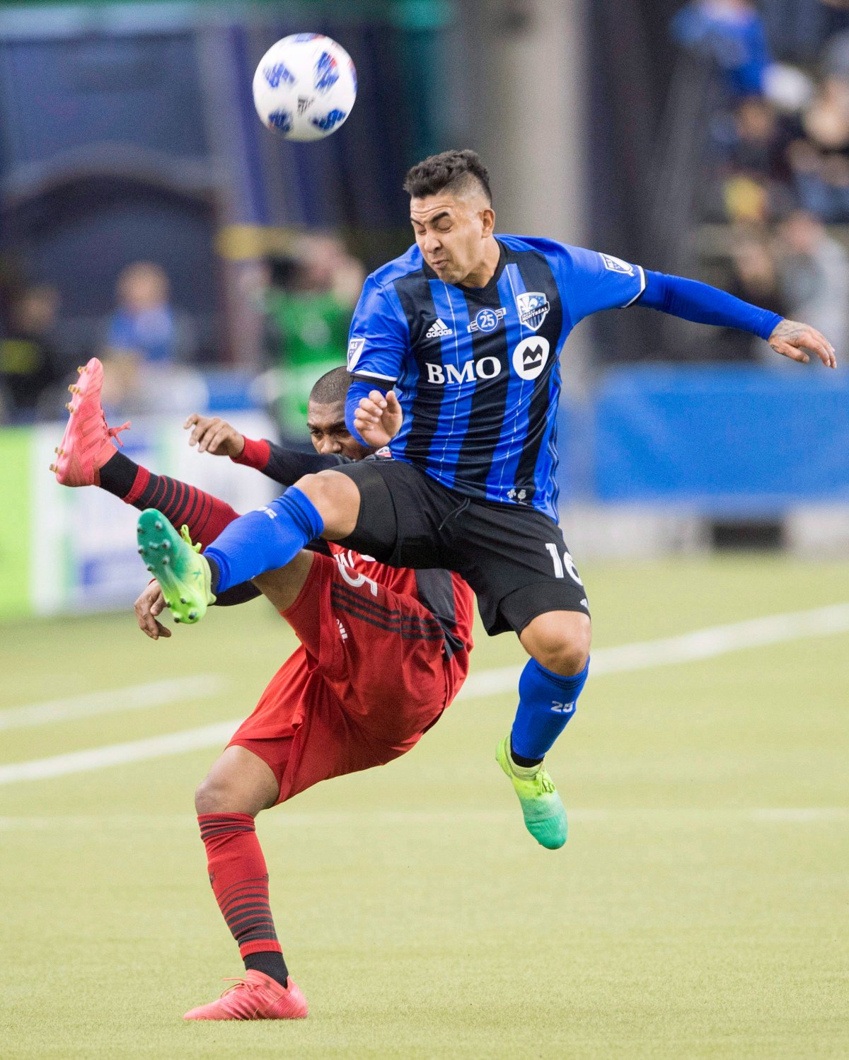 Montreal Impact forward David Choiniere (17) jumps for the ball with Toronto FC defender Ashtone Morgan (5) during second half MLS action in Montreal on Saturday, March 17, 2018.