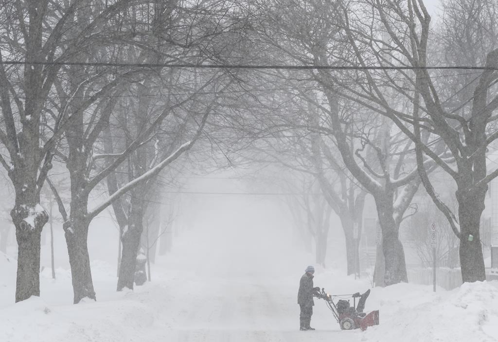 A man uses a snowblower to clear snow during a snowstorm in Halifax on Monday, March 4, 2019.