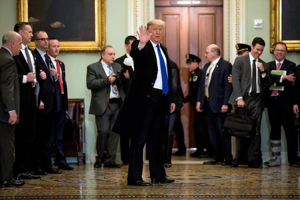President Donald Trump speaks to members of the media as he departs a Senate Republican policy lunch on Capitol Hill in Washington, Tuesday, March 26, 2019.