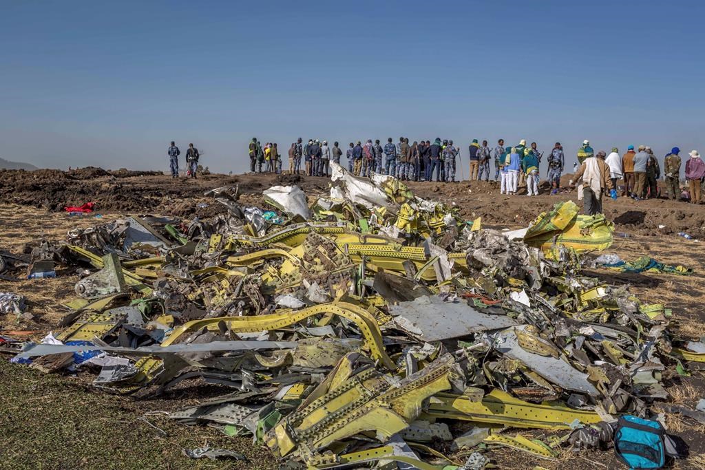 Wreckage is piled at the scene of an Ethiopian Airlines flight crash near Bishoftu, or Debre Zeit, south of Addis Ababa, Ethiopia, Monday, March 11, 2019.
