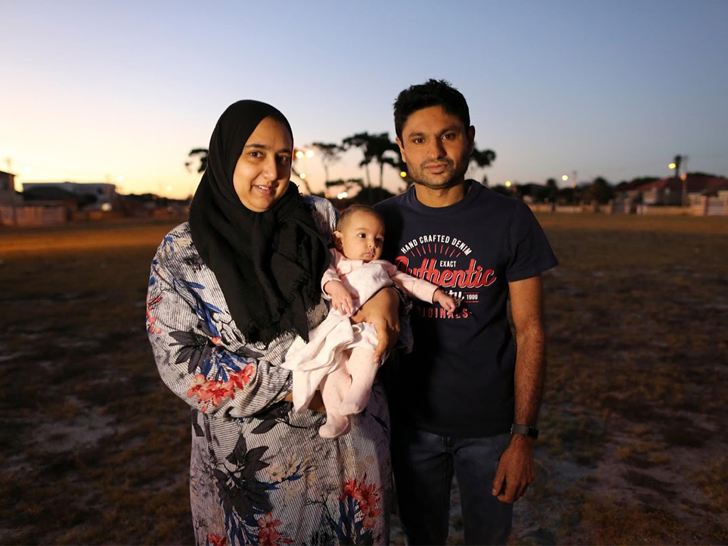 Ferzanah, her husband Hassan, 37, and their baby Salma, four and a half months old, on the morning of Ferzanah’s first day back to work. South African labour law allows mothers to take four months of consecutive maternity leave although employers are not obliged to pay employees during this time.