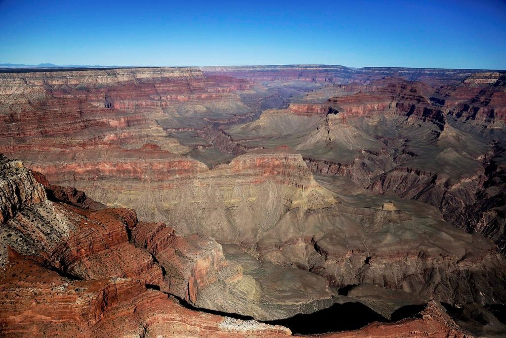 In this Oct. 5, 2013 file photo, the Grand Canyon National Park is covered in the morning sunlight as seen from a helicopter near Tusayan, Ariz.