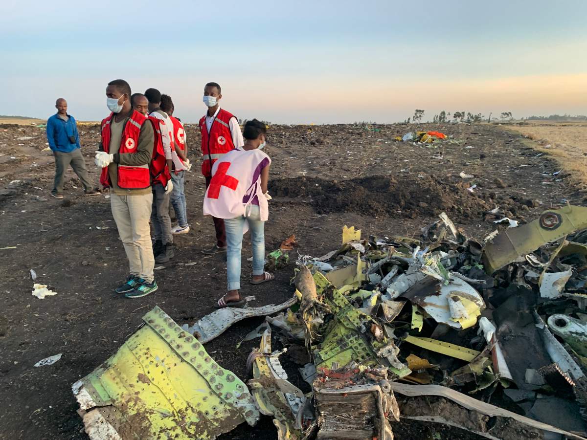 Rescuers work beside the wreckage of an Ethiopian Airlines’ aircraft at the crash site, some 50 km east of Addis Ababa, capital of Ethiopia, on March 10, 2019.