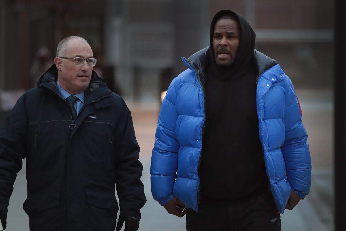 R. Kelly (R) and his attorney Steve Greenberg leave Cook County jail after Kelly posted $100,000 bond on Feb. 25, 2019, in Chicago, Ill.