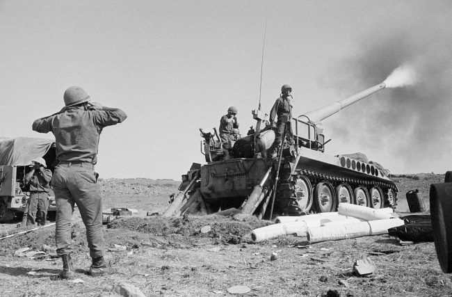 Israeli soldiers fire a 175mm self-propelled field gun against Syrian forces from the Golan Heights, Oct. 11, 1973.