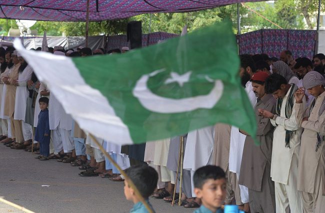Pakistani supporters of banned organisation Jamaat-ud-Dawa (JuD) offer funeral prayer for Indian-occupied Kashmir Hizbul Mujahideen commander Burhan Wani and denounce recent violence by Indian security forces during a protest in Islamabad on July 15, 2016.