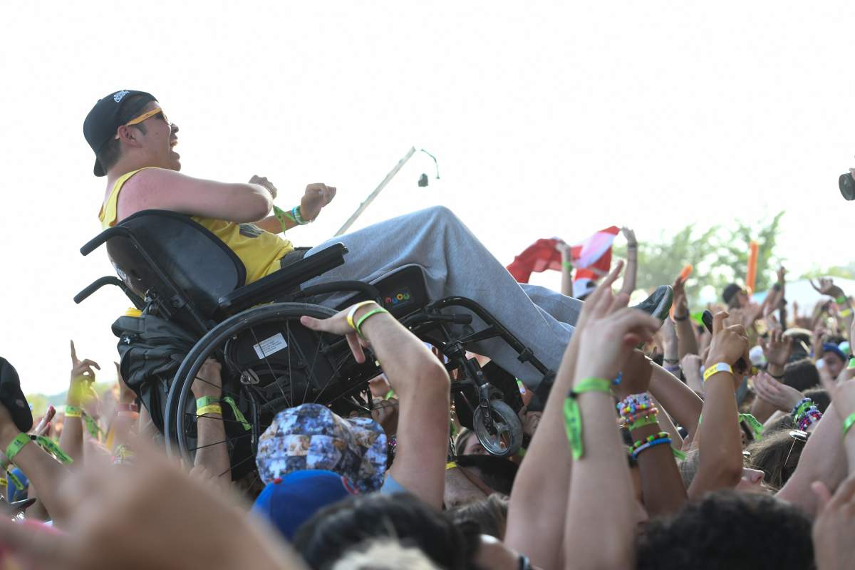 A man crowd surfs during Veld Music Festival at Downsview Park on July 30, 2016 in Toronto.
