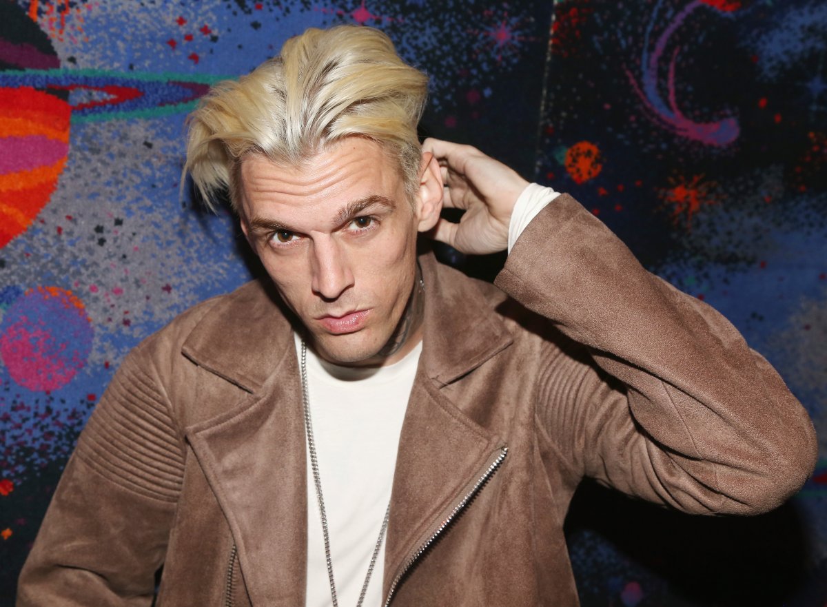 Aaron Carter poses during a handprint ceremony and meet & greet with fans as he visits Planet Hollywood Times Square on April 24, 2017 in New York City.