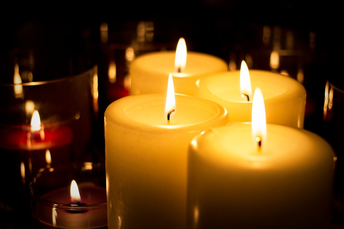 Guelph police say a 25-year-old woman's hair was lit on fire after she fell asleep near burning candles on Monday night.
