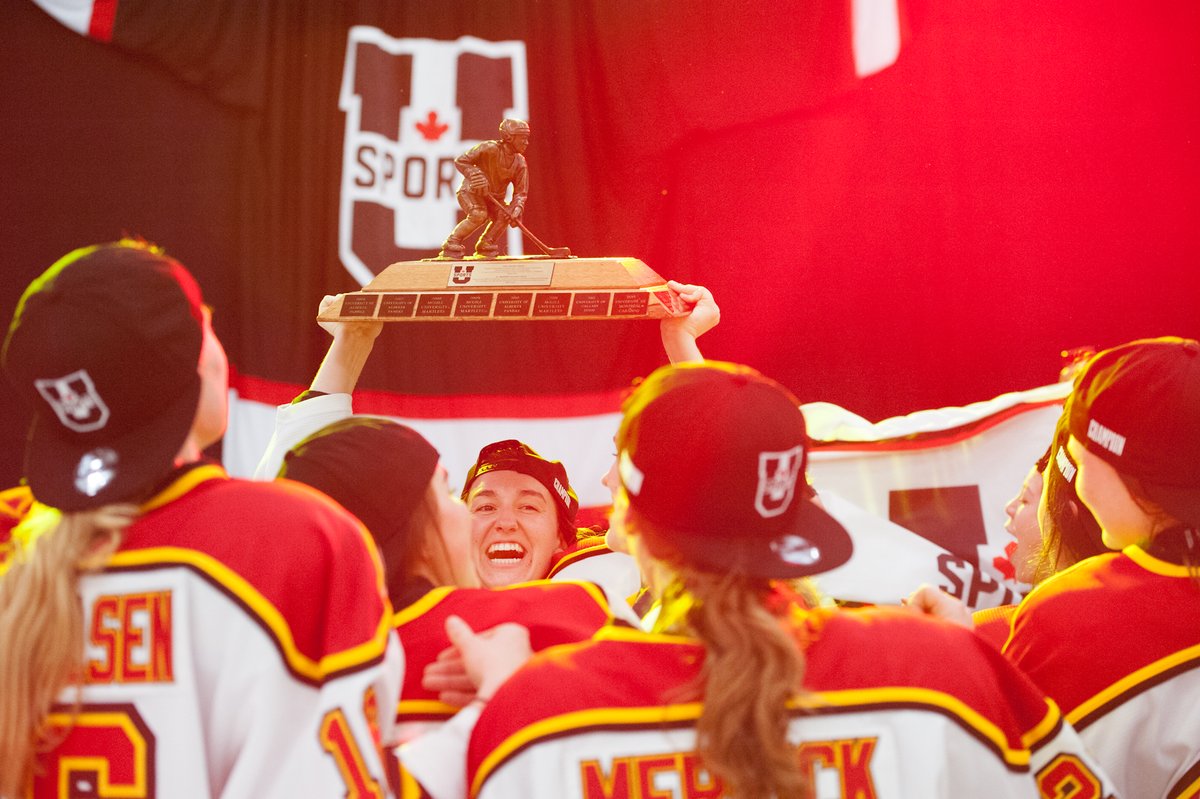 The Guelph Gryphons' women's hockey team celebrates their national championship on Sunday after a 1-0 win over the McGill Martlets.