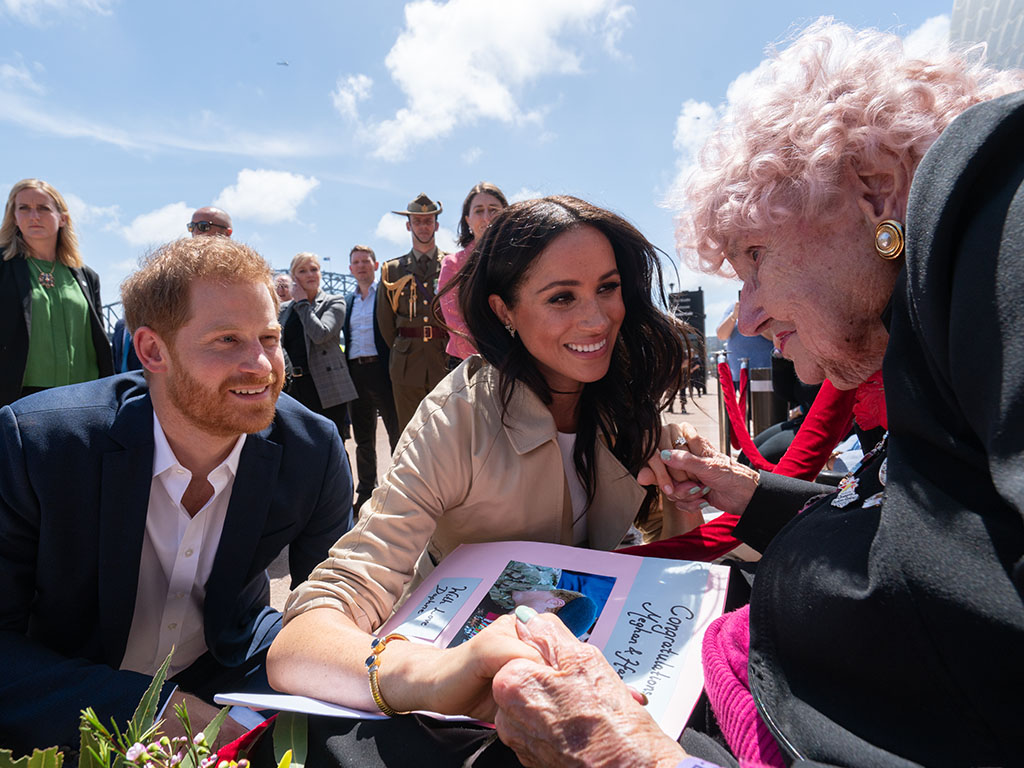 Prince Harry Meghan Markle greet Daphne Dunne at Sydney Opera House on Oct. 16, 2018, in Sydney, Australia.
