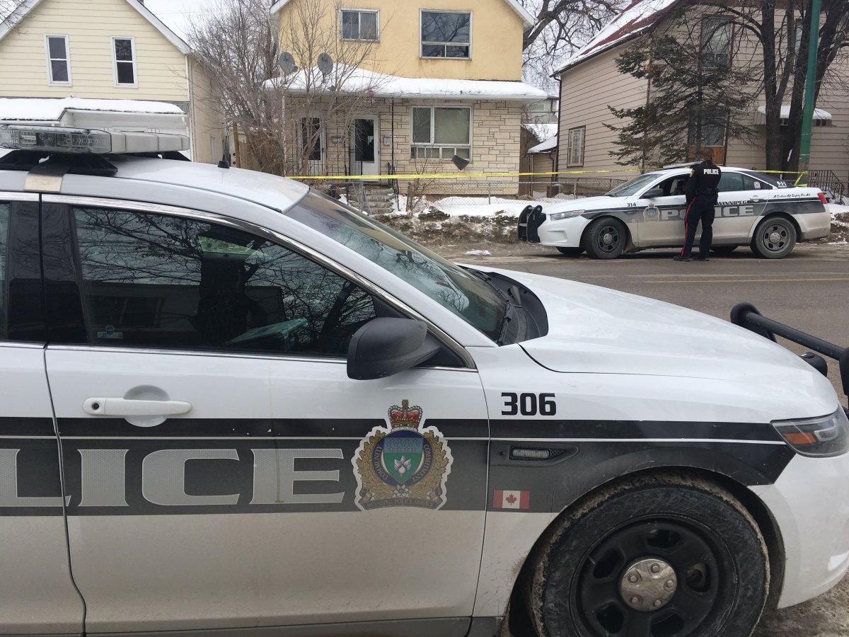 Winnipeg police in front of the scene of a homicide on Friday, March 8, 2019.