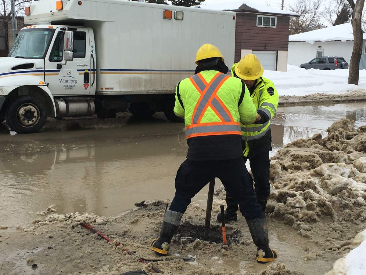 City of Winnipeg workers on Sinclair Street Friday.