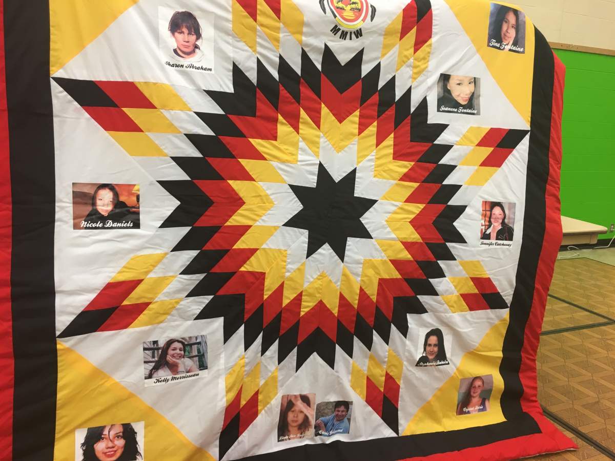 A star blanket featuring the images of Missing and Murdered Indigenous Women.