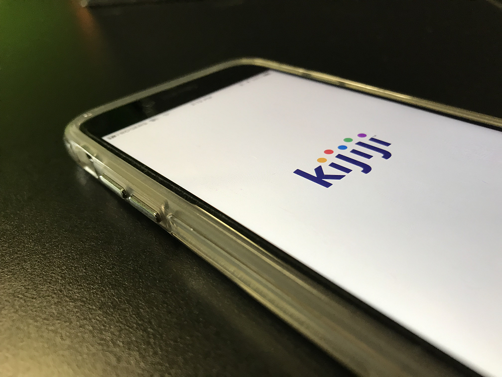 A Kijiji buy-and-sell website logo on a cell phone.