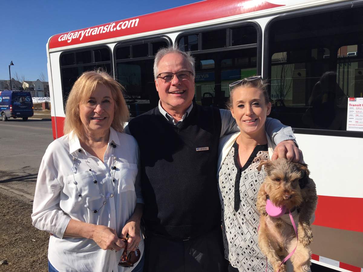 Leslie Sammel, David Bolander and Shannon Sammel pose with Charlie the dog. 