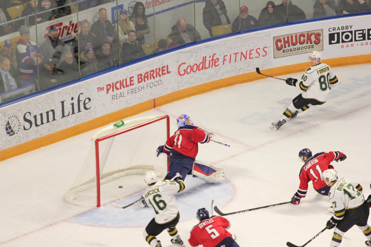 Kitchener, Ont. - Kevin Hancock of the London Knights scores his 50th goal of the season as part of an 8-6 London win over the Rangers on March 1, 2019.