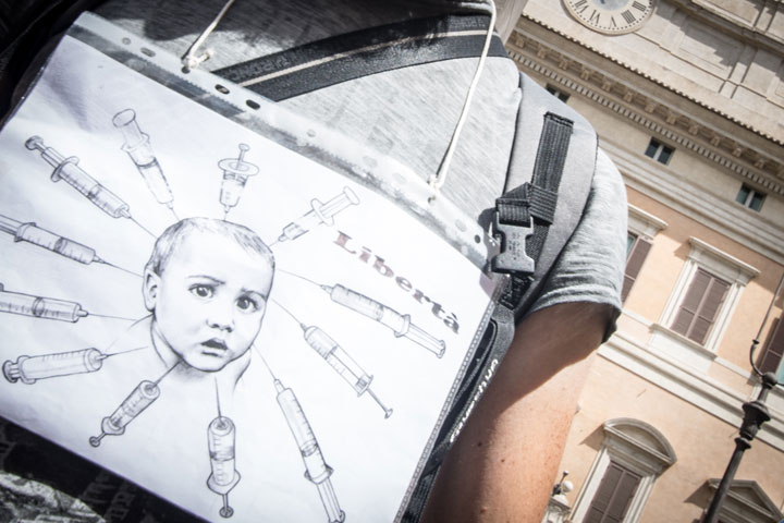 A protestor speaks out against mandatory vaccination in Italy in July 2017. Italy's mandatory vaccination law came into effect in March 2019.